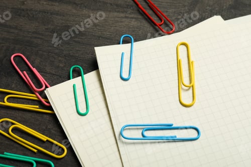 Preview: Concept of different office accessories - paper with clip