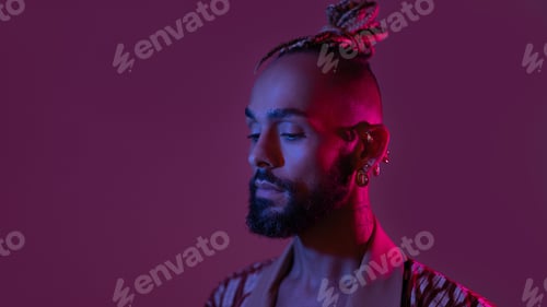 Preview: Neon light studio close-up portrait handsome black gay man looking camera.