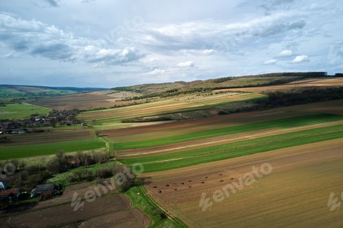 Preview: Aerial view of plowed agricultural fields with cultivated fertile soil prepared for planting