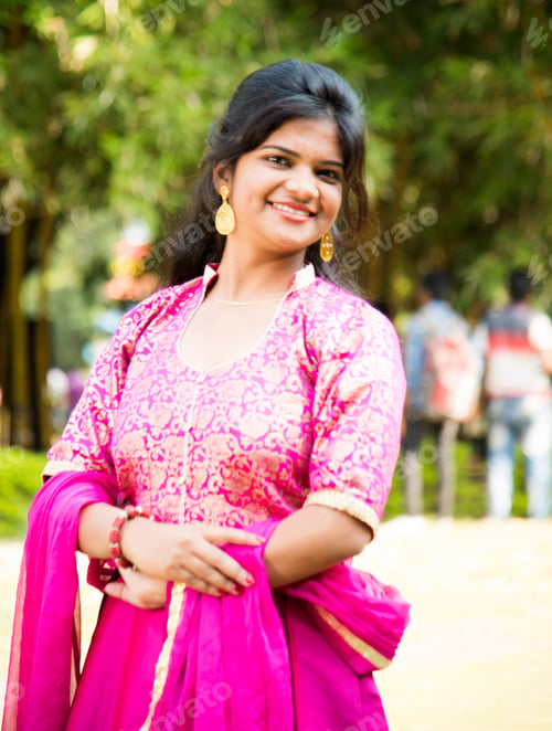 Preview: Outdoor portrait of beautiful young Indian girl in traditional dress.