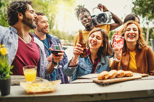 Preview: Buddies on vacations socializing drinking cocktails, beers and wine