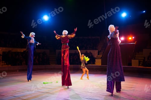 Preview: Jugglers in the circus. Clown on stilts