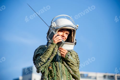 Preview: Boy wearing a space suit and using walkie talkie