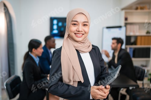 Preview: Successful asian businesswoman working and looking camera in a meeting room.