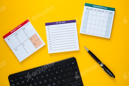 Preview: Manager is planning a busy week using a calendar, a monthly planner and a to do list