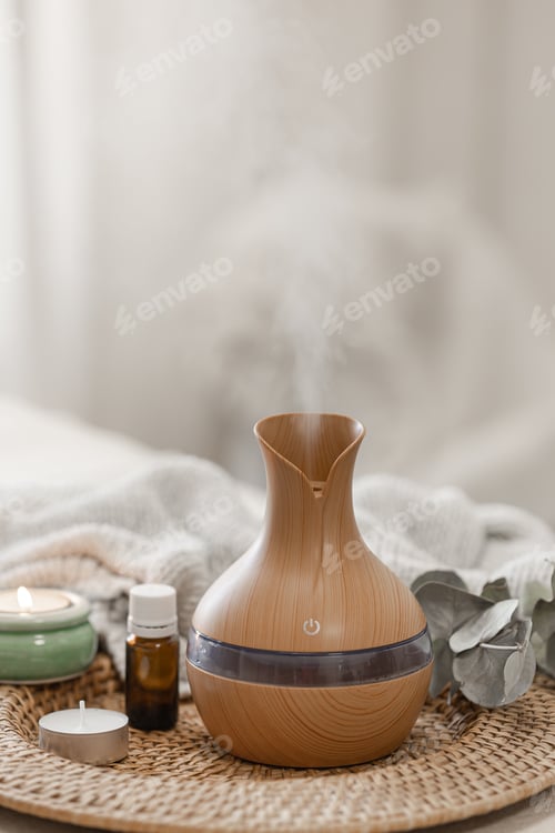 Preview: Spa composition with aroma oil diffuser lamp on a blurred background.