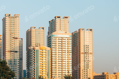 Preview: New Residential Multi-storey Houses. Cityscape Skyline In Sunny Spring Evening On Blue Sky. Real