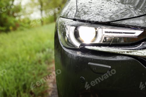 Preview: Car parked outdoors on rainy day, closeup