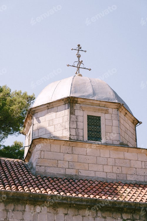 Preview: Dome of a brick church with a cross on the background of the sky