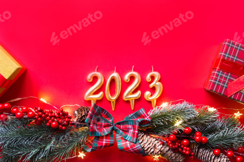 Preview: Happy New Year- golden candles numbers 2023 on a red background with Christmas tree, sequins, stars,
