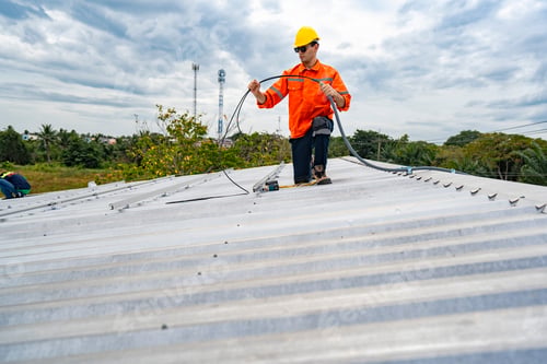 Preview: skilled technician adjusts a solar panel on rooftop
