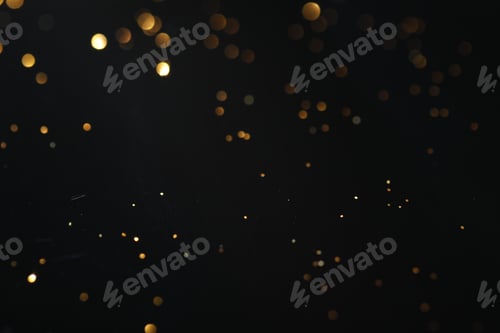 Preview: Beautiful shiny golden glitter on black background, closeup