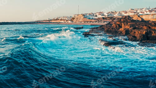 Preview: Beautiful travel destination with rocky shore during sunset. Drone view of a Beautiful town on ocean