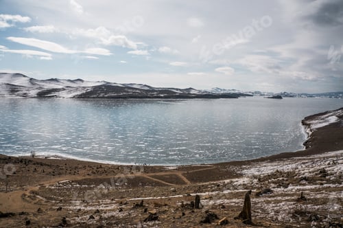 Preview: beautiful landscape view of pond and mountains on background, Russia, Lake Baikal, march 2016