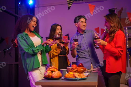 Preview: An African American woman a white woman celebrate coworkers, drinking,having fun smiling together
