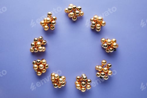 Preview: round frame of shiny golden Christmas decoration on blue background with copy space