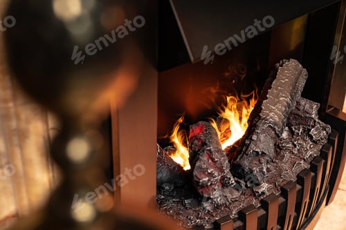 Preview: Wood logs burning in fireplace close up