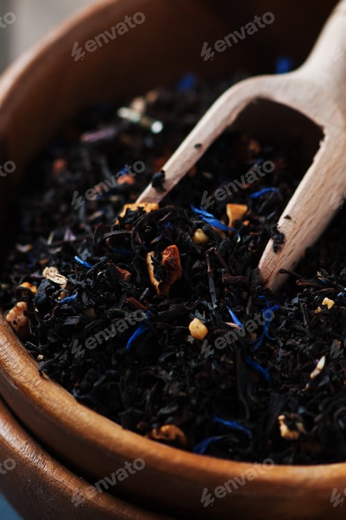 Preview: Raw black tea on the wooden table, selective focus
