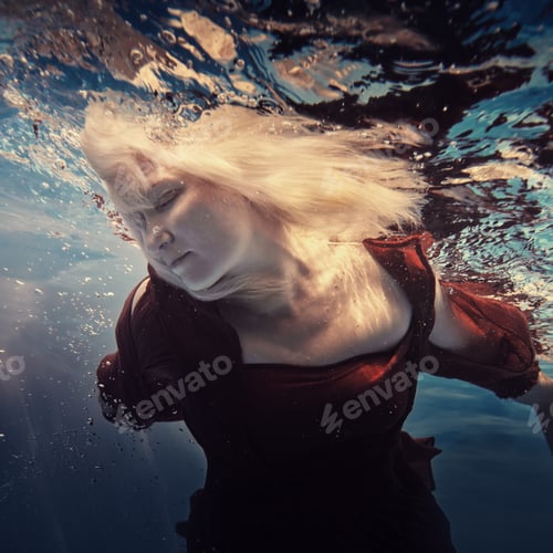 Preview: Portrait Of A Woman In A Red Dress Underwater