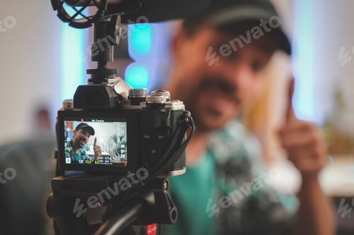 Preview: Behind the scene shot of a young man influencer making a video