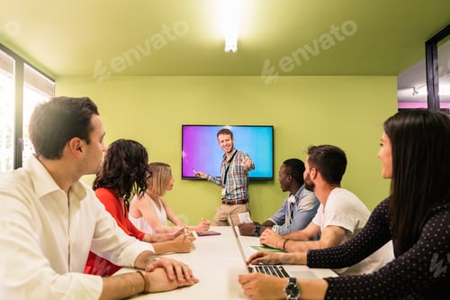 Preview: Teacher explaining the lesson to his students.