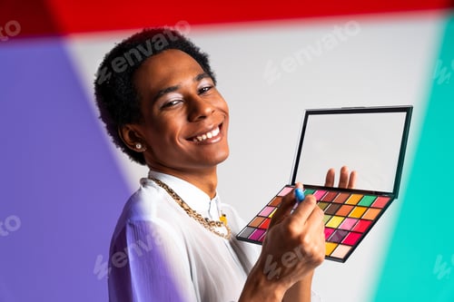 Preview: Fashionable fluid gender man posing in studio