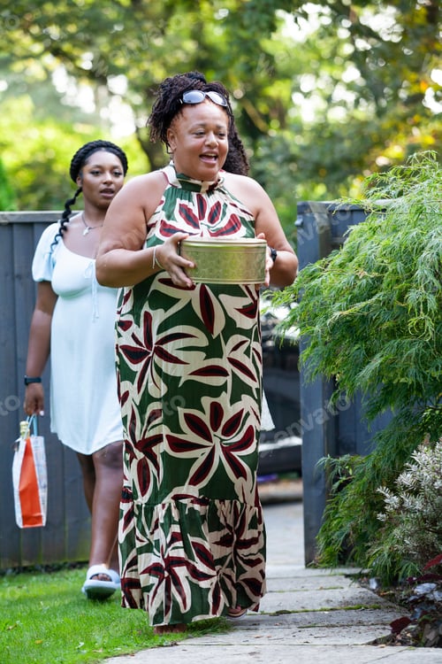 Preview: Friends and family arriving at a summer garden party