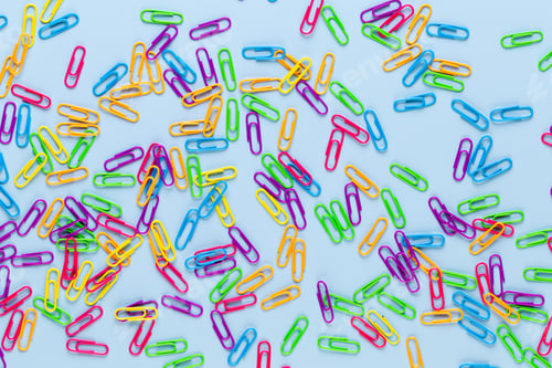Preview: Paper color clip notebook on blue background. Flat lay.