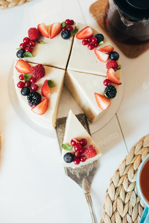 Preview: Top view of cake decorated by summer berries. Delicious vegan dessert gluten, sugar, lactose free.