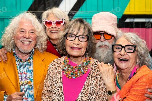 Preview: Group of happy senior friends with fancy clothing having party in the night