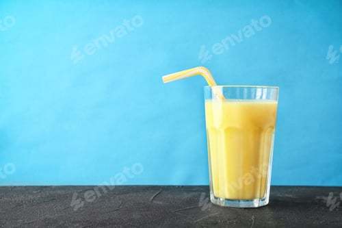 Preview: Glass with delicious detox smoothie on table