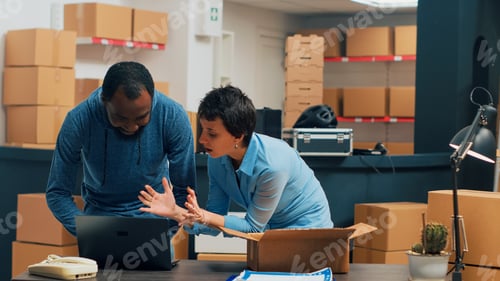 Preview: Two entrepreneurs checking supply chain on storehouse shelves