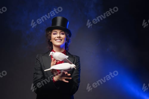Preview: Smiling magician woman in magical costume with white doves
