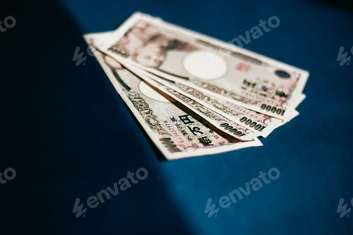 Preview: Japanese Yen Banknotes on a Dark Background