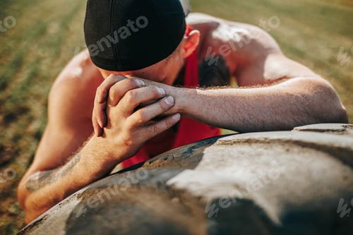 Preview: Outdoor Fitness Portrait of a Tired Muscular Man Leaning on Tire After Crossfit Training
