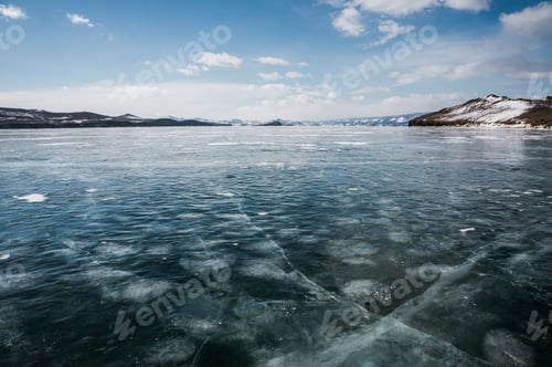 Preview: beautiful landscape view of frozen river and mountains in winter, Russia, Lake Baikal, march 2016
