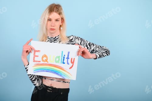 Preview: Young gay man 20s with make up isolated on a colored background, studio portrait.