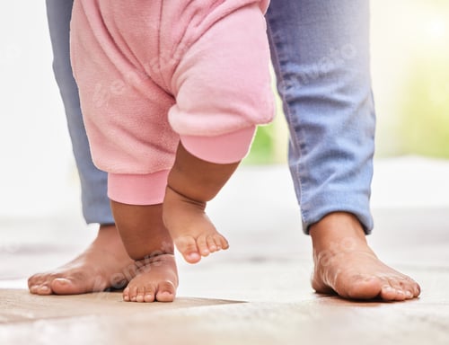 Preview: Mother, baby feet and walking with help and support or care with milestone and first steps. A woman
