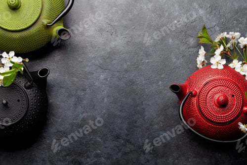 Preview: Japanese tea in tea pot and cherry blossom