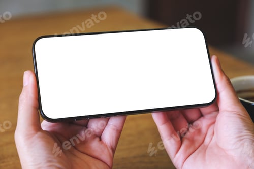Preview: Mockup image of a woman holding mobile phone with blank desktop screen