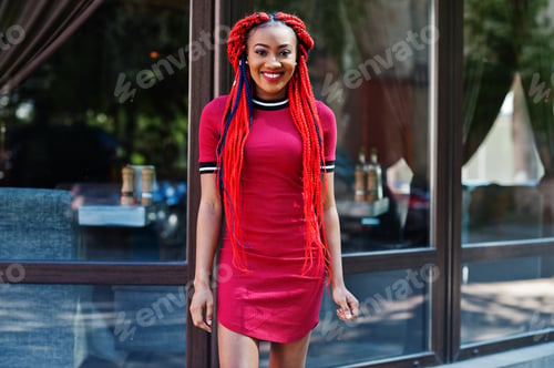 Preview: African american girl in red dress with dreadlocks
