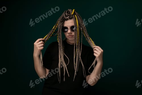 Preview: Man With Dreadlocks Holding Hair in Front of His Face