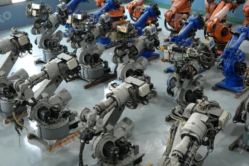 Preview: Robotics engineer working on maintenance of robotic arm in factory warehouse. Business technology.