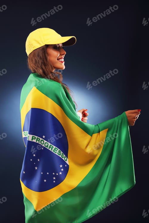 Preview: Happy Brazilian fan cheering with flag