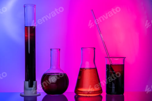 Preview: Laboratory glass tubes with chemicals on bright pink background