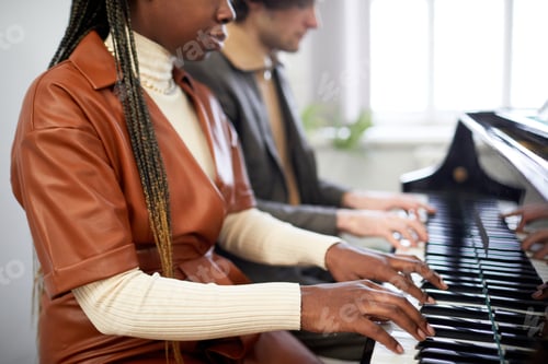 Preview: Woman playing the piano together with partner