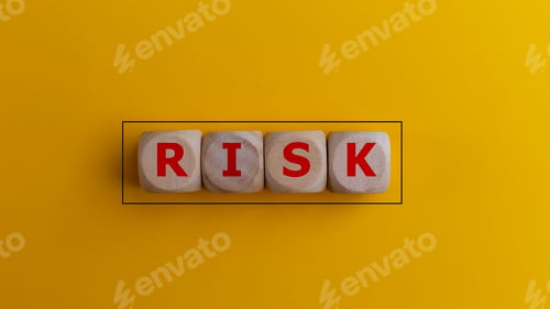 Preview: Wooden cubes with the word risk. Risk-taking, risk management, or assessment concept.