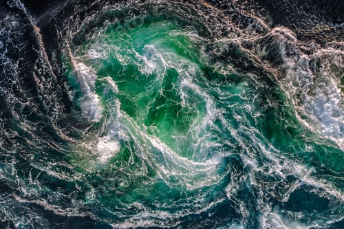 Preview: Blue waves of water of the river and the sea meet each other during high tide and low tide.