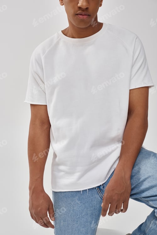 Preview: stylish african american man in trendy casual jeans and white t-shirt, copy space for advertising