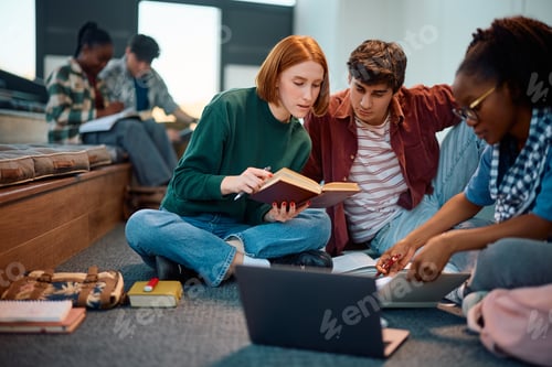 Preview: Diverse college students cooperating while learning together at campus.